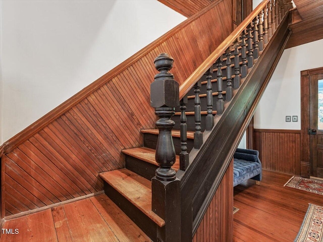 967 Bynum Rd, Pittsboro, NC 27312 - staircase with wainscoting, wood walls, and wood-type flooring