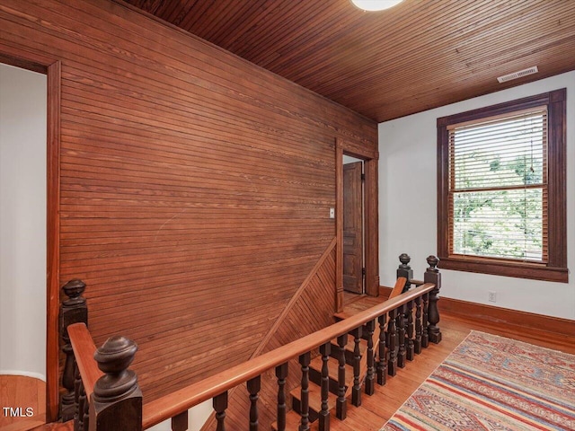 967 Bynum Rd, Pittsboro, NC 27312 - corridor featuring an upstairs landing, wood walls, wood finished floors, and wood ceiling
