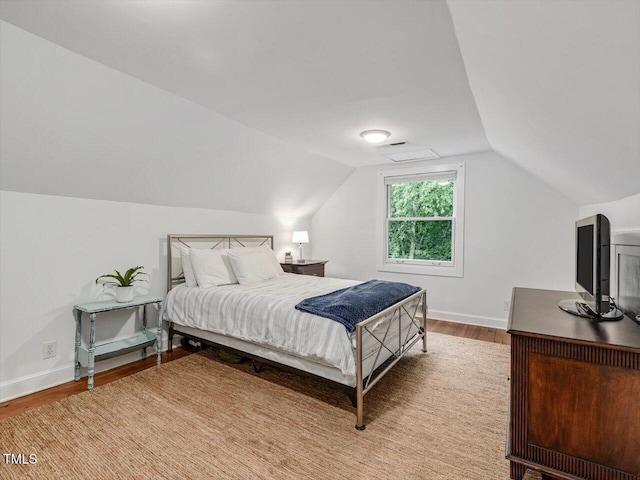 967 Bynum Rd, Pittsboro, NC 27312 - bedroom with wood finished floors, vaulted ceiling, and baseboards