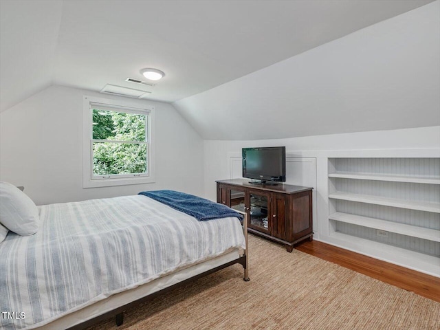 967 Bynum Rd, Pittsboro, NC 27312 - bedroom with wood finished floors and vaulted ceiling