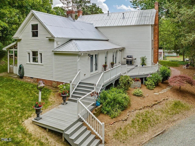 967 Bynum Rd, Pittsboro, NC 27312 - rear view of house with stairs, a chimney, a deck, metal roof, and crawl space