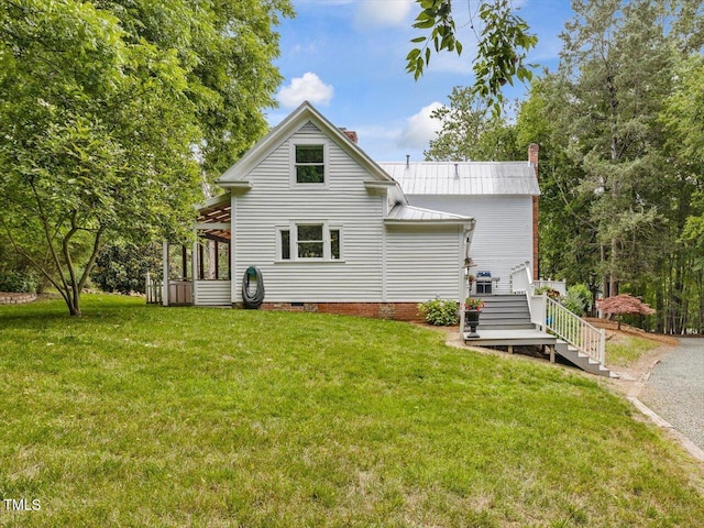 967 Bynum Rd, Pittsboro, NC 27312 - back of house with a chimney, a lawn, a deck, and metal roof