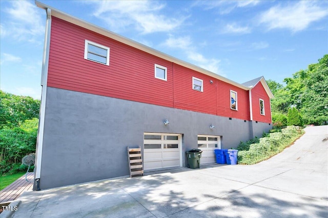 view of side of property featuring a garage