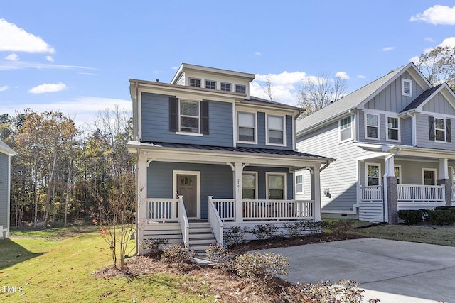 view of front of house with a front lawn and a porch