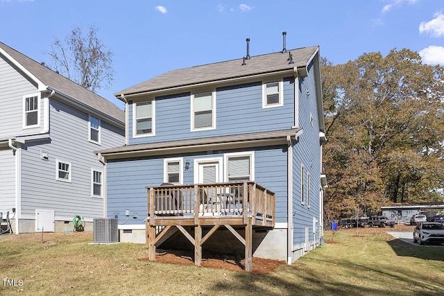 rear view of property with a wooden deck, central AC unit, and a lawn