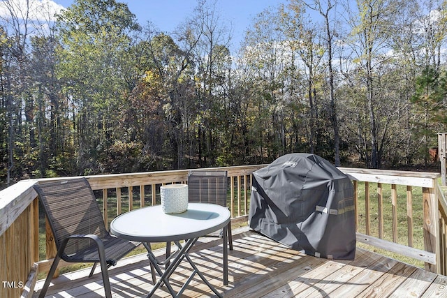 wooden terrace featuring area for grilling