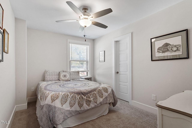 bedroom featuring ceiling fan and carpet