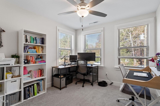 carpeted home office with ceiling fan