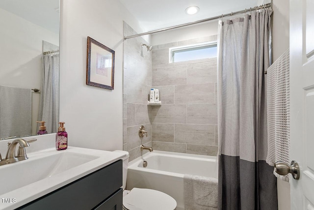 full bathroom with toilet, vanity, and shower / bathtub combination with curtain