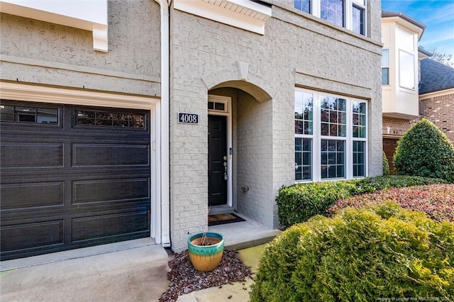 entrance to property featuring a garage