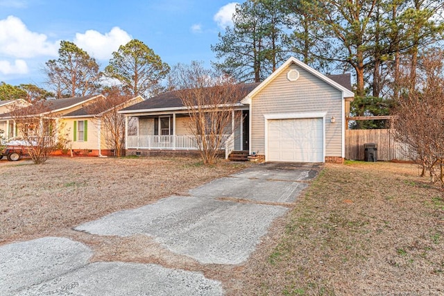 ranch-style house with a garage and a porch