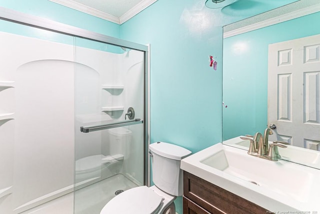 bathroom featuring crown molding, a shower with shower door, vanity, and toilet