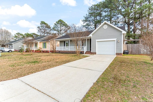 ranch-style house with fence, a front yard, covered porch, a garage, and driveway