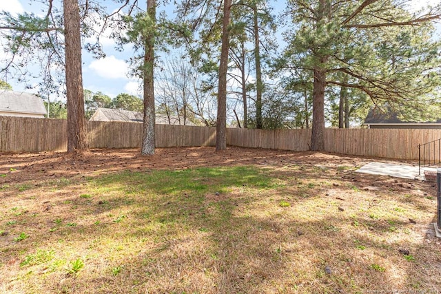 view of yard with a fenced backyard