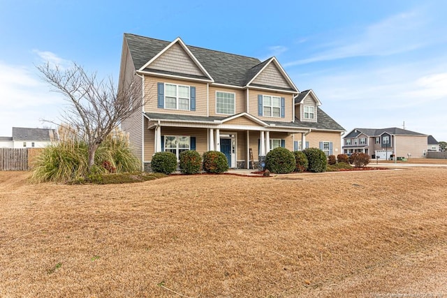 view of front of home featuring a porch and a front yard