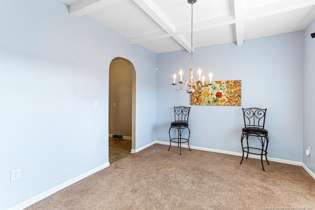 interior space featuring beamed ceiling, carpet floors, and a chandelier