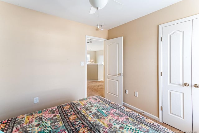 bedroom featuring ceiling fan and carpet floors