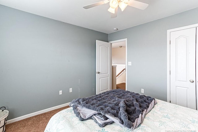 bedroom featuring ceiling fan and carpet