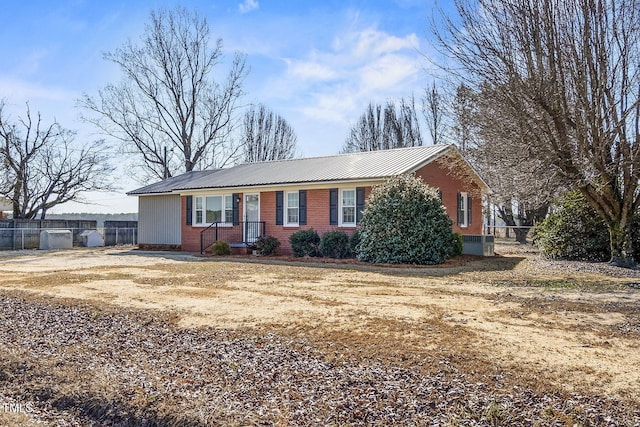 single story home featuring central AC unit