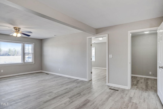 unfurnished bedroom featuring multiple windows, light hardwood / wood-style flooring, beamed ceiling, and ceiling fan