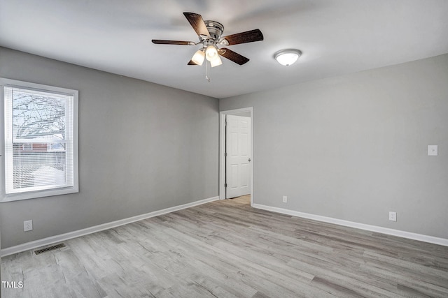 unfurnished room with ceiling fan and light hardwood / wood-style floors