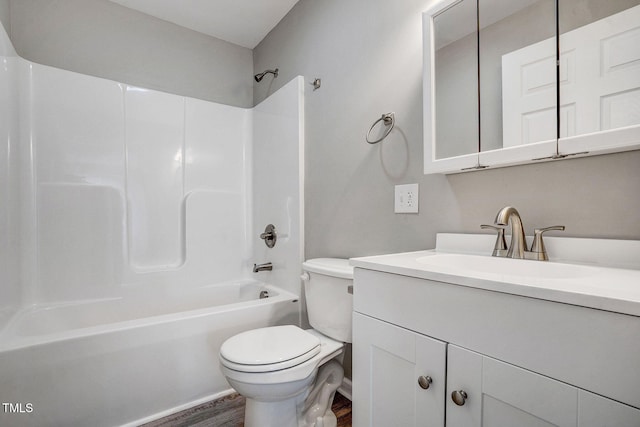 full bathroom with hardwood / wood-style flooring, vanity, shower / bathtub combination, and toilet