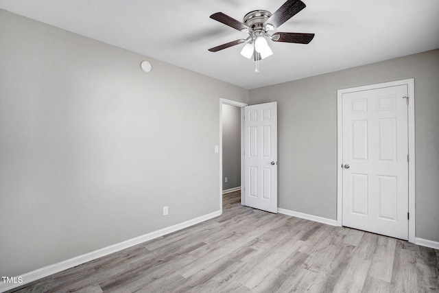 unfurnished bedroom featuring ceiling fan and light hardwood / wood-style floors