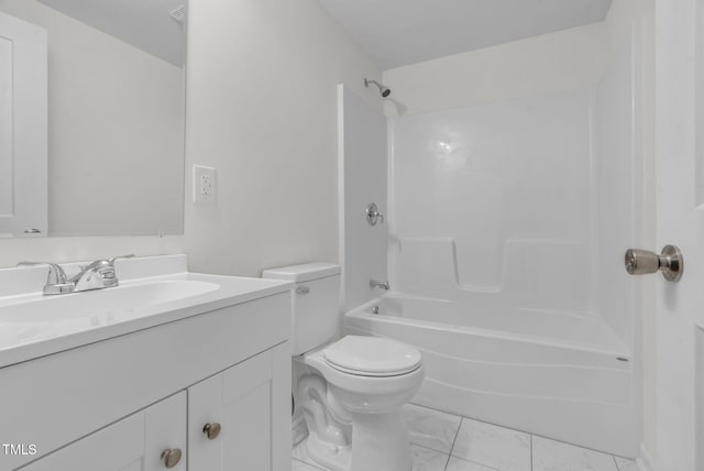 bathroom featuring toilet, vanity, and shower / washtub combination