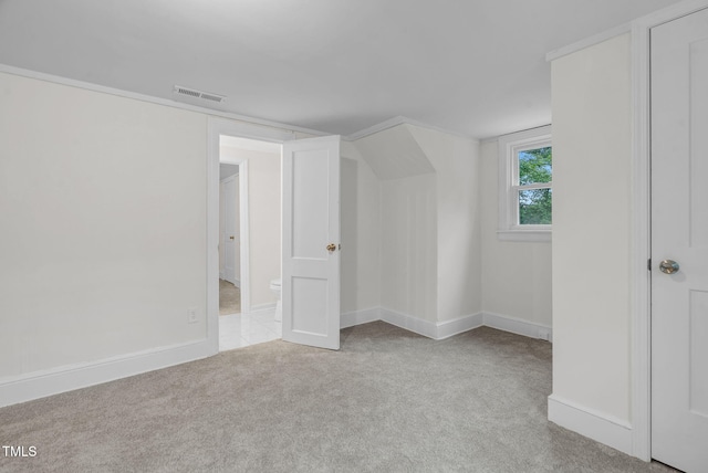 bonus room with carpet flooring and baseboards