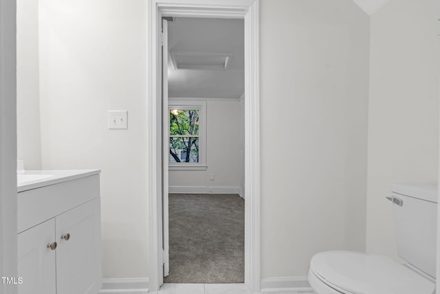 bathroom featuring toilet and baseboards