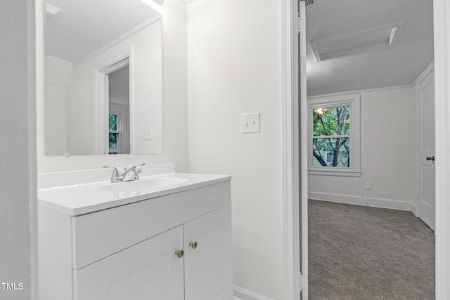 bathroom with vanity and baseboards