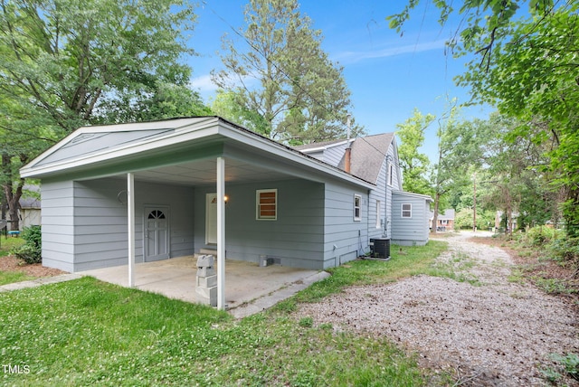 view of side of property featuring a patio area