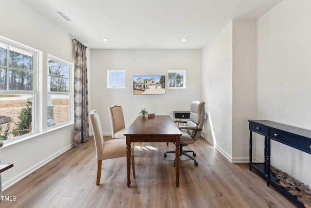 office area with wood finished floors, baseboards, and a wealth of natural light