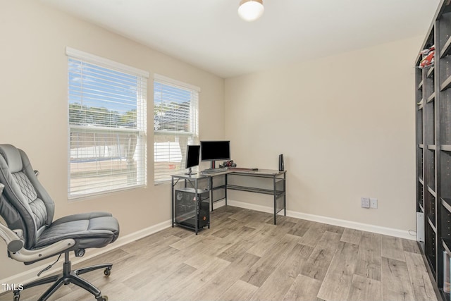 office area with light hardwood / wood-style flooring