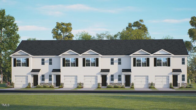 165 Holton St, Smithfield, NC 27577 - townhome / multi-family property with stone siding, a garage, and a front lawn