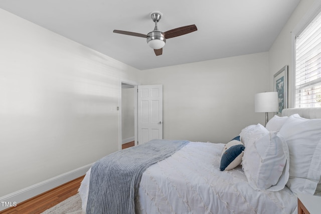 bedroom featuring ceiling fan and hardwood / wood-style floors