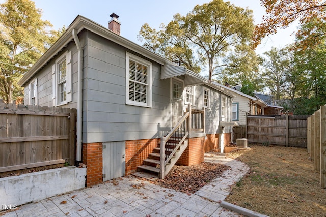 back of property featuring a patio area