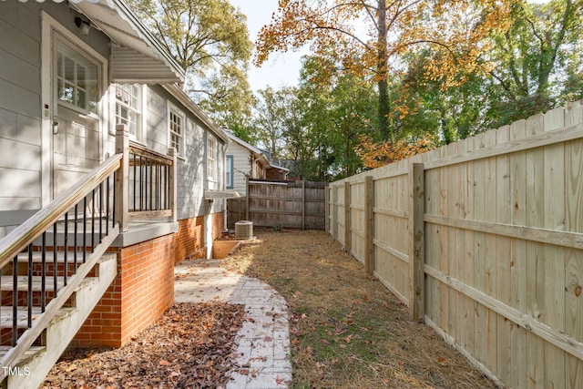 view of yard with central AC