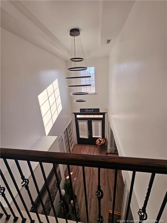 stairs with hardwood / wood-style floors