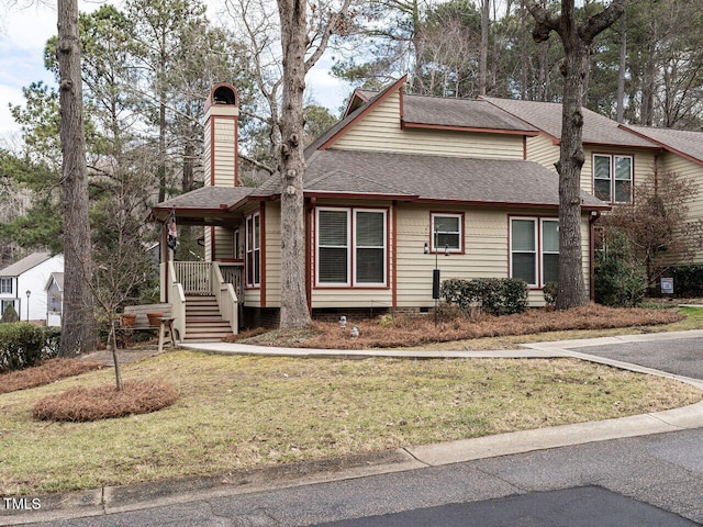 view of property with a porch and a front yard