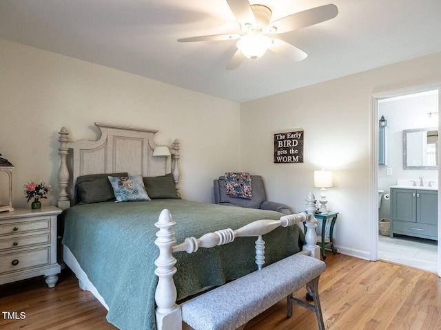 bedroom with connected bathroom, hardwood / wood-style floors, and ceiling fan