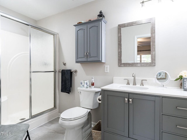 bathroom featuring vanity, an enclosed shower, and toilet