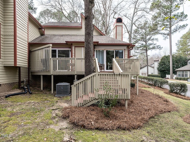 rear view of house featuring a deck and central AC unit