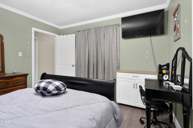 bedroom with dark wood-style floors, crown molding, and a textured ceiling