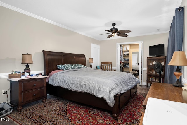 bedroom with ornamental molding and a ceiling fan