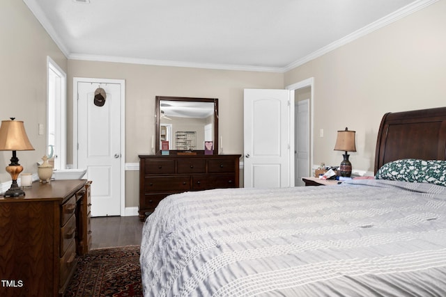 bedroom featuring dark wood-style floors and ornamental molding