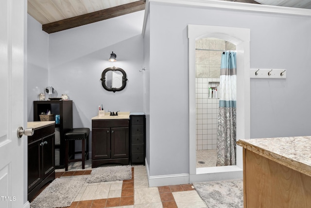 full bathroom featuring a stall shower, vanity, and tile patterned floors