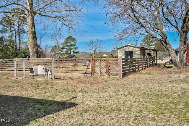 view of yard featuring a gate and fence