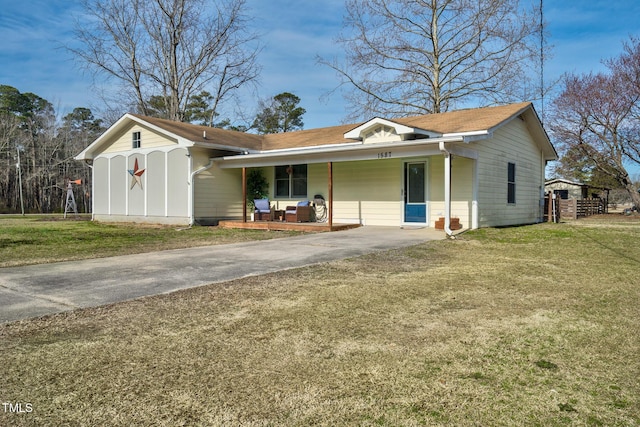 view of front of house with a porch and a front yard