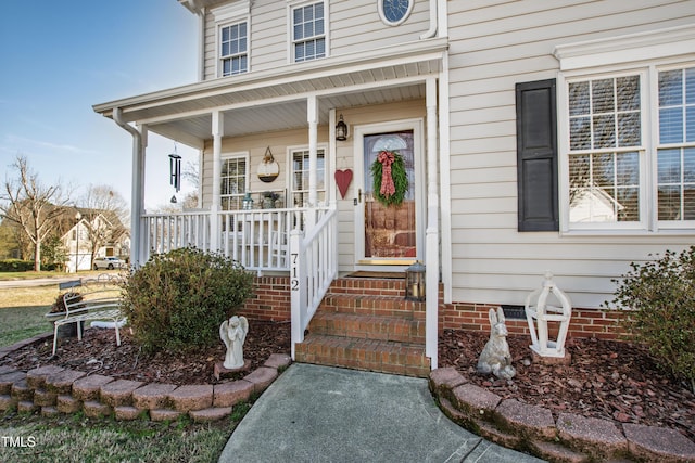 property entrance with covered porch